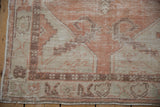 Oushak runner corner, worn apricot and ivory geometric floral motifs with intact selvage.