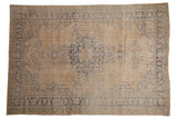 Distressed Oushak carpet, cream field, cobalt blue medallion and floral arabesques.