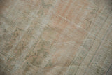 Detailed view of the distressed Oushak's low pile showing mostly even wear to the knot heads.