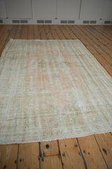 Reverse side of a vintage Turkish Oushak rug showing the hand-knotted foundation.