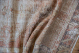 Soft, hand-knotted pile of a distressed Oushak rug with characterful, time-softened even wear.