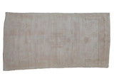 Distressed vintage Oushak runner, subtle stepped medallion, abrashed ivory and beige field, 3'1