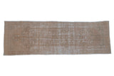 Distressed vintage Oushak runner with faded gold, beige, and ivory medallion pattern, 3'1