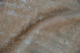 Distressed texture on a vintage Oushak runner, showing low beige pile and exposed foundation.