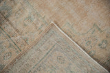 Distressed vintage Oushak carpet pile showing wear to foundation and intact selvage.