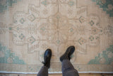 Distressed Oushak rug runner showing even wear across the knot heads and pale turquoise pattern.