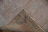 Vintage Oushak rug pile and hand-knotted foundation with pink processing mark.