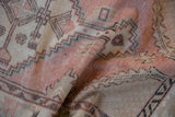 Distressed Oushak runner, soft dusty pink, beige, and turquoise geometric patterns.