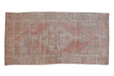 Distressed vintage Oushak runner with faded blush and beige stepped medallion, 2'6