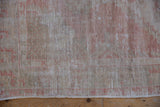 Distressed Oushak runner pile texture, mostly even wear, exposed foundation, blush, ivory hues.