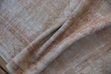 Detail of the vintage Oushak's even wear, revealing a soft low pile and hand-knotted texture.