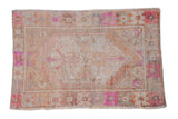 Vintage Distressed Oushak rug, oversized central medallion, soft beige, fuchsia, and copper floral pattern, 2'9