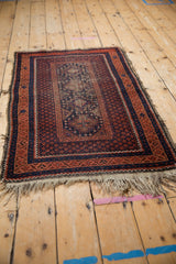 Turkmen Beshir rug's central field with stepped floral guls and seed motifs in terracotta and indigo.