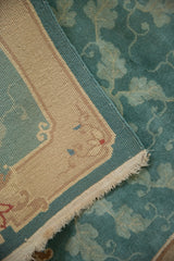 Vintage Nichols runner close-up: jade green scrolling vinery pile, sand foundation, and woven selvage.