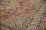 Distressed madder root rust medallion and sand floral field of the vintage Turkish Sparta rug.