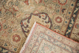 Distressed Sparta carpet pile, with madder root rust florals, visible foundation, and reverse weave.