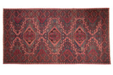 Vintage distressed Caucasian Soumac runner with fuchsia and charcoal geometric medallion design, 6'9