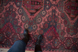 Vintage distressed Soumac runner with abrashed field, serrated medallions, pale fuchsia, and charcoal.