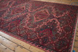 Distressed vintage Soumac runner detail: serrated medallion with ram's horn guls.