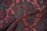 Geometric motif detail with raspberry red, charcoal, and blue accents on the vintage Soumac runner.