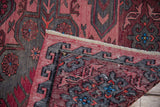 Vintage Caucasian Soumac rug with burgundy abrash pile and geometric woven reverse.