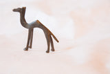 Vintage African bronze camel casting, highlighting the textured, dark patina.