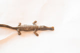 Vintage bronze crocodile casting with visible handmade texture and aged patina.