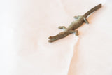 Aged bronze texture of the vintage African crocodile casting, showing its head.