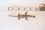 Vintage African bronze crocodile sculpture measured at 4.5 inches for scale.