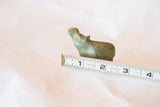 Vintage African bronze hippo casting with measuring tape illustrating scale.