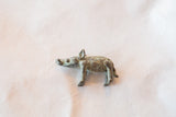 Handmade African bronze boar casting with a rustic, verdigris and brown patina.