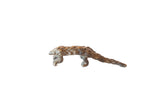 Vintage African bronze casting of a pangolin with textured, overlapping scales and a dark patina.