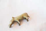 Side view of a vintage bronze hippo highlighting its simple neck lines and aged finish.