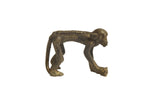 Vintage monkey bronze gold weight on all fours with a textured spine and long curved tail.