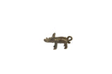Vintage African boar pendant with a dark bronze patina and stylized handmade details.