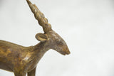 African bronze antelope sculpture head with large spiral horns and rich patina.
