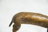 Textured back and tail of vintage bronze antelope sculpture with rich patina.