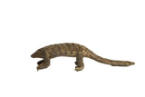 Vintage African bronze pangolin sculpture with detailed, overlapping scales and a weathered patina.
