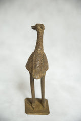 Vintage African bronze fishing bird sculpture, frontal view showing textured body and base.