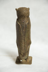 Textured bronze body of vintage African lost wax owl sculpture.