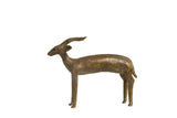 Vintage African bronze antelope sculpture with large spiral horns and aged patina, 8 inches tall.