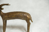 Aged bronze texture and tail detail of the vintage African antelope sculpture.