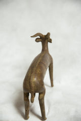 Rear view of vintage African bronze antelope sculpture, highlighting spine texture and strong legs.