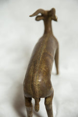 Vintage African bronze antelope sculpture, detailed braided spine and aged patina.