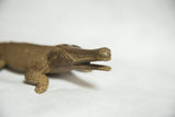Intricate textured head and open mouth of the vintage bronze crocodile sculpture.