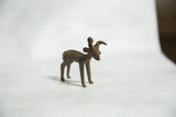 Vintage bronze ram gold weight with a dark patina, shown from a three-quarters angle.