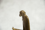 Vintage African bronze monkey sculpture: profile of head with aged patina.