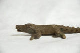 The imperfect, broken snout of the low cast vintage African bronze crocodile sculpture.