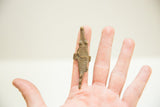 Vintage African bronze crocodile ring with a textured patina worn on a finger.