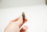 Side profile of the vintage African bronze ring's cast and textured band.